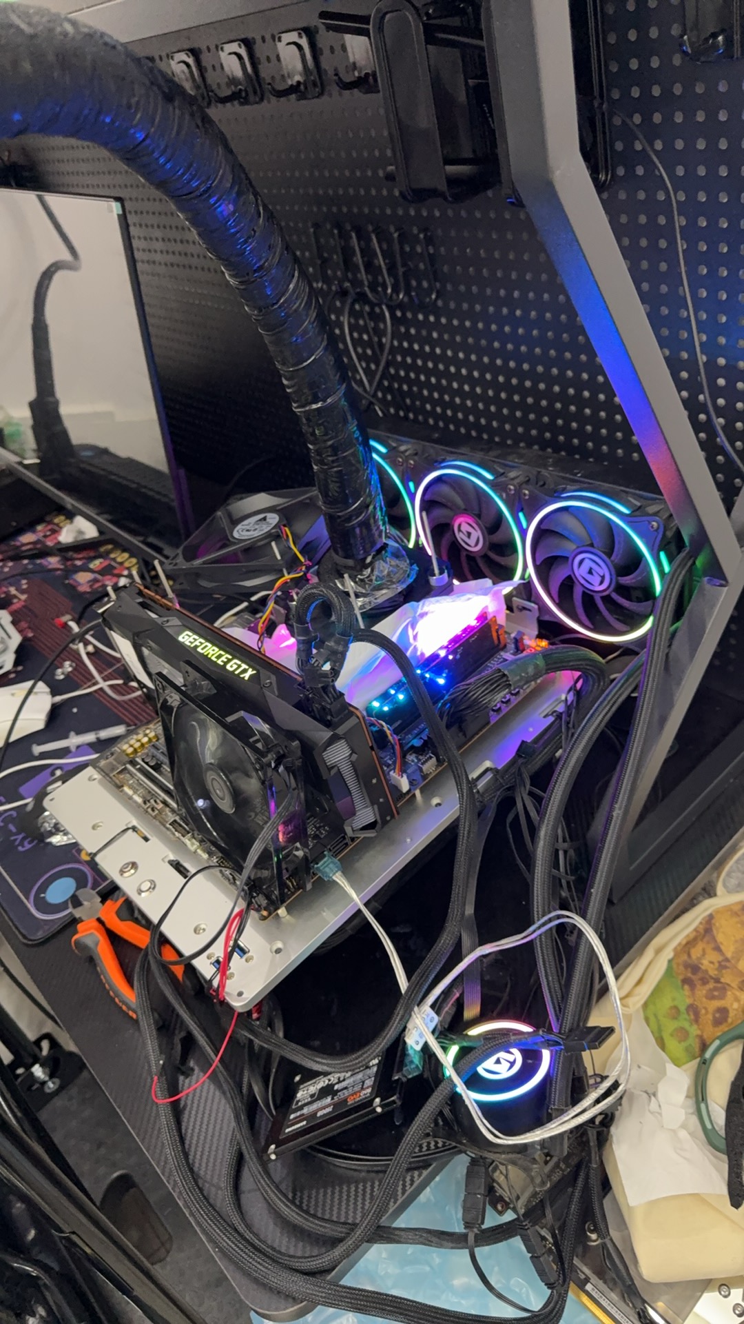 Cascade cooling prototype with compressor hardware, copper lines, and condenser fan
