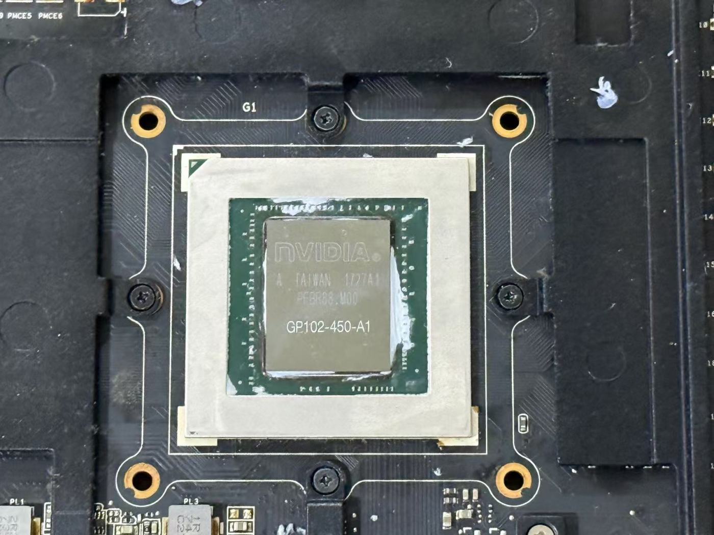 Close-up of a GP102 GPU core mounted on a graphics card PCB